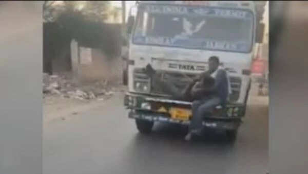 லாரியில் கட்டப்பட்ட இளைஞர்