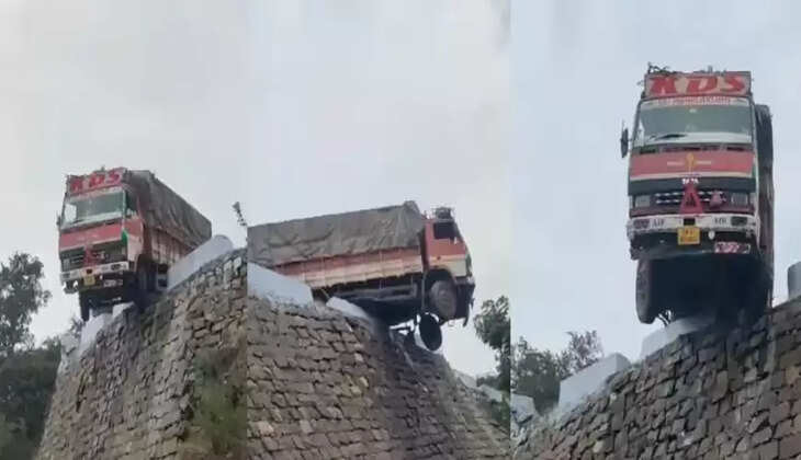 அந்தரத்தில் தொங்கிய லாரி