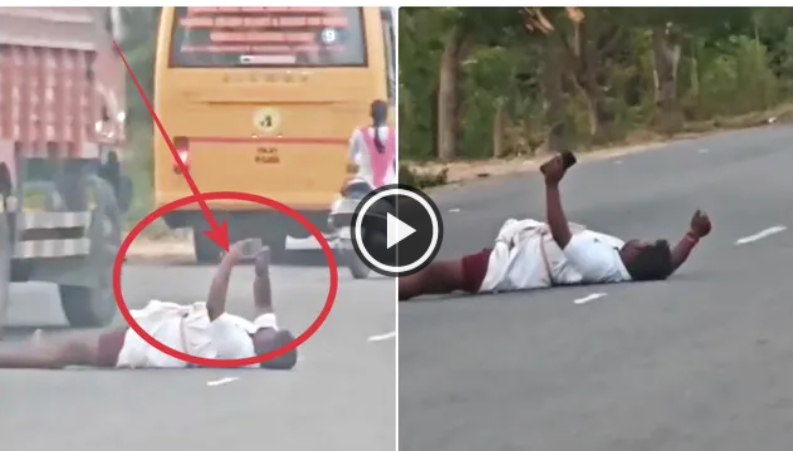 போதையில் அட்டூழியம்... நட்டநடு சாலையில் படுத்துக்கொண்டு செல்ஃபி எடுத்த நபர் !