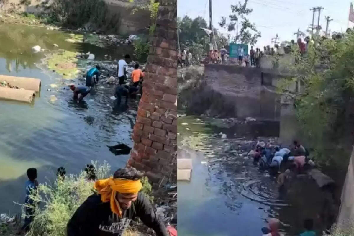 வைரல் வீடியோ!! கழிவு நீரில் கட்டுகட்டா பணம்!! குவியல் , குவியலாய் அள்ளிச்சென்ற மக்கள்!!