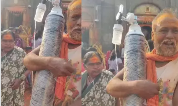 ஆக்சிஜன் சிலிண்டருடன் மனைவியை தூக்கிச் சென்ற கணவர்… பக்தர்கள் நெகிழ்ச்சி!