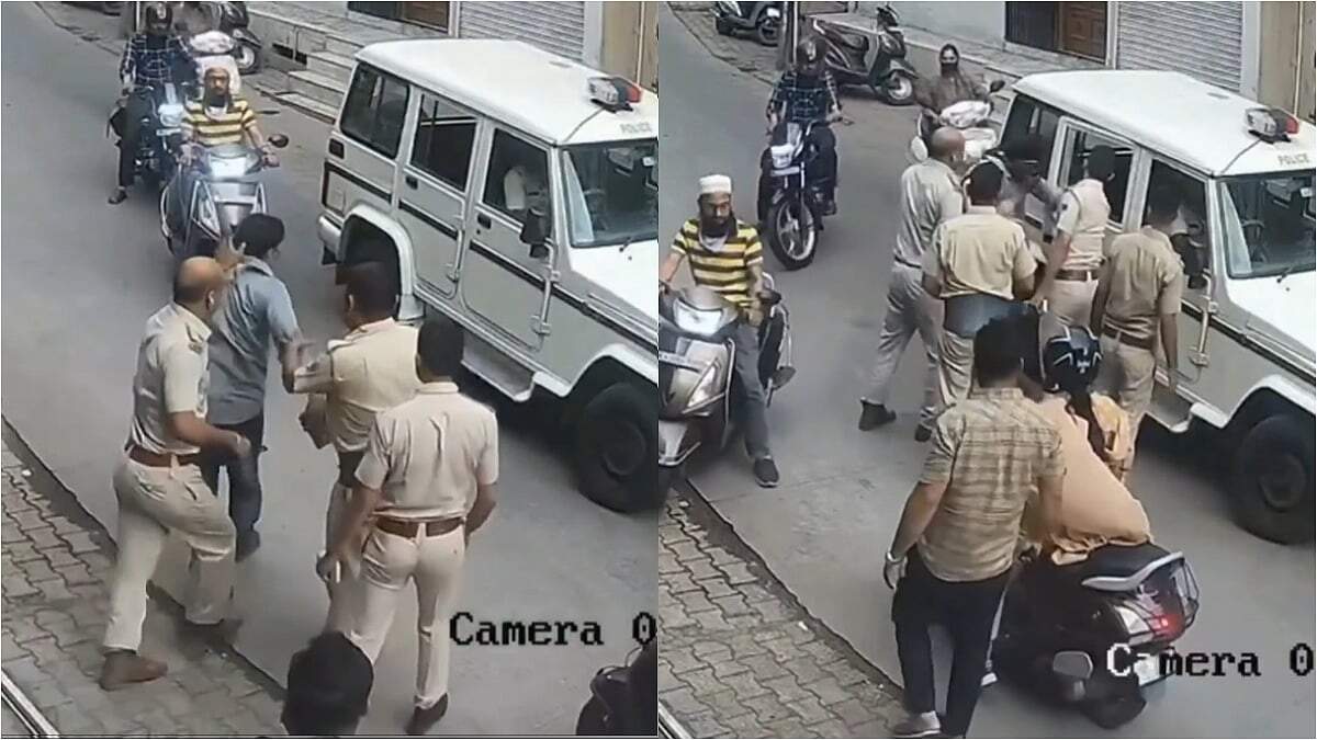 வைரலாகும் அதிர்ச்சி வீடியோ... போலீஸ் அதிகாரி தாக்கியதில் நடுரோட்டில் மயங்கி விழுந்த கடைக்காரர்!